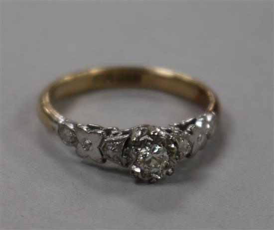 An 18ct gold, platinum and solitaire diamond ring, in illusion setting, size O
